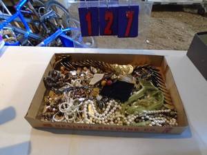 Flat of costume jewelry. As shown.