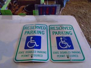 Qty of 2 handicap signs. As shown.