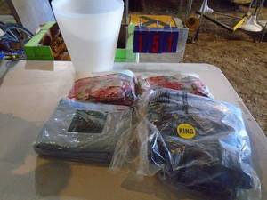 King size sheets in 2 plastic waste baskets. As shown.