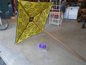 Mikes hard lemonade square wood frame cloth umbrella. As shown.