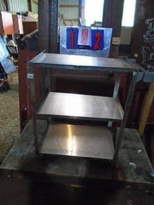 Stainless steel rolling cart. 32 x 27 x 16. As shown.