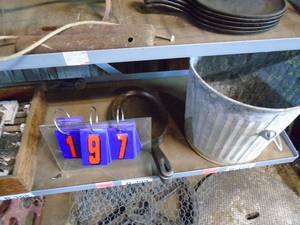 Items on third shelf with door parts, lodge plates & coal bucket. As shown.