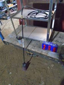 Propane weed burner torch. As shown.
