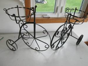lot 18 image: 2 ornate metal tricycle pot holders...