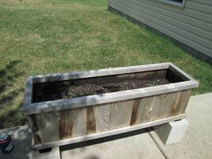 lot 67 image: Planter box full of potting soil 40...