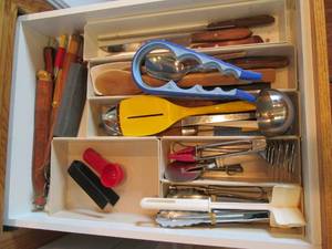 lot 88 image: Contents of drawer including pizza ...