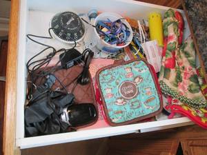 lot 95 image: Drawer contents including oven mitt...