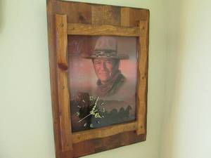 lot 102 image: Awesome John Wayne clock 19.527....