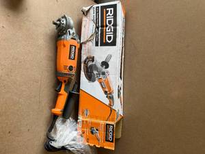lot 71 image: RIDGID 15 Amp Corded 7 in. Twist Handle Angle Grinder