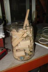 lot 146 image: Glass Jug with Wooden Blocks