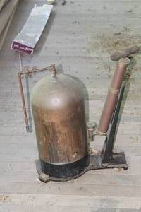lot 228 image: Vintage Tank w Pump