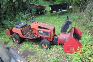lot 4 image: Toro 8hp Gas Rider Lawn Mower with Toro 36 Snowblower Attachment