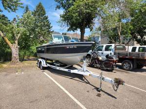 lot 1 image: 1993 21 Lund Baron 2100 Runabout Boat with Inboard MerCruiser Motor and 1992 EZ Loader Boat Trailer