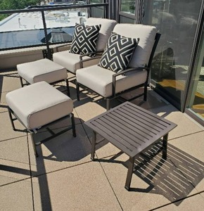 Two Outdoor Chairs with Ottomans and End Table