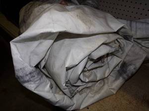 Large Heavy Duty Tarp for Woodpile may have holes or rips