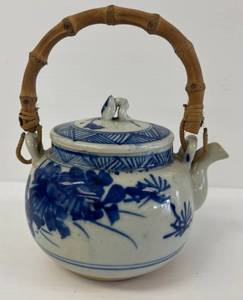 lot 47 image: Very Old Oriental Themed Blue And White Pottery Teapot 5 12 x 6 12 With Bamboo Handle