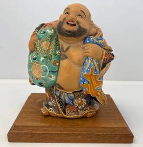 lot 188 image: Very Cool Vintage Japanese Porcelain Figural Statue With Multi Colored Raised Design With Wood Base 7 14 x 5 12 (No Cracks Or Chips)