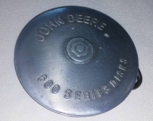 lot 35 image: John Deere Belt Buckle 600 Series Disks, 1989