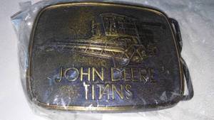 lot 39 image: John Deere Belt Buckle Titans Combine