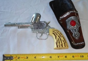 lot 43 image: Toy Cap Pistol and Holster, Vintage