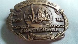 lot 71 image: N.D. Commemorative Belt Buckle 100 Anniversary