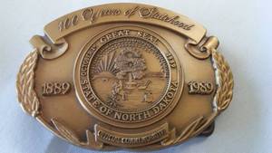 lot 75 image: N.D. Centennial Belt Buckle