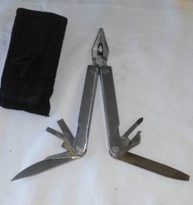 lot 80 image: Authentic Leatherman Tool & Pouch.