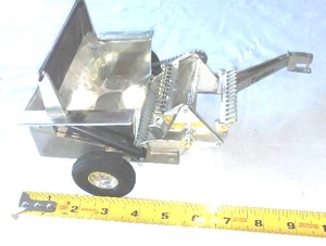 lot 95 image: Chrome Hay Straw Baler.