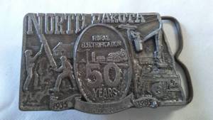 lot 115 image: Belt Buckle 50 Years Rural Electrification N. D.