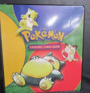 POKEMON TRADING CARDS IN A POKEMON BINDER