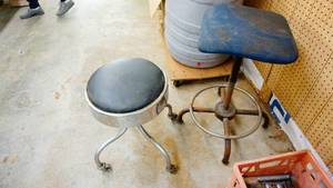 Round Stool On Casters & A Leather Padded Seat---A Textured Cloth Stool On Four Steel Legs