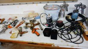 Metal bucket of assorted garage items