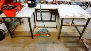 Custom built steel framed cubby workbench 30 inches high by 60 inches long and 31 inches deep with drop down center