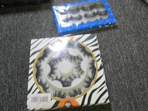 lot 229 image: box of fake eyelashes , hair clips,...