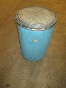 lot 491 image: blue barrel with potato sacks in it...