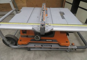 RIDGID TABLE SAW MOUNTED ON RIDGID WORK AND HAUL IT 2 WHEEL WORK STAND