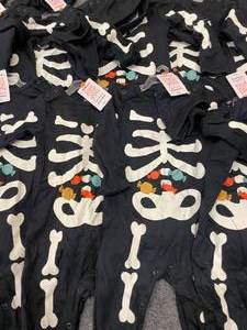 lot 74 image: Lot of 10 Carters Infant Halloween One Piece Skeleton Outfits 6-9 mo