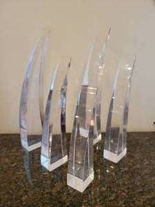 lot 18 image: A striking set of set of five unmarked MCM curved Lucite sculptures in the style of Hivo Van Teal and Shlomi Haziza.