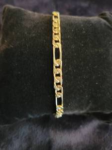 lot 39 image: 14K Yellow Gold Figaro Style Bracelet 9.6 grams. Hallmarked .585