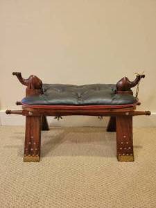 lot 55 image: Wood and Leather Camel Saddle.