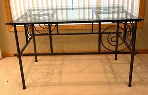 lot 77 image: Whimsical Black Metal Table with Glass Top