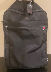 lot 142 image: Tumi Soft Sided Rolling Bag