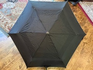 lot 148 image: Tumi and Wind Jammer Umbrellas