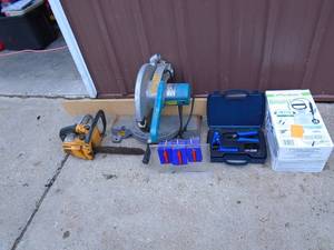 Makita 12 miter saw. Handle has been repaired. Tested & works. And chain saw for repair. As shown.