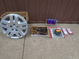Assorted tools. Including hub caps, door bell, door opener controls. As shown.