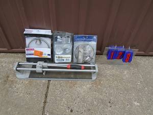 Tile cutter & plumbing supplies. As shown.