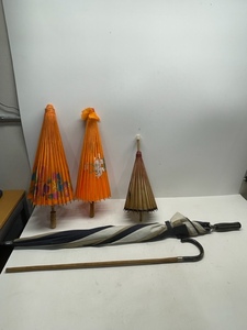 Assorted Umbrellas and Cane