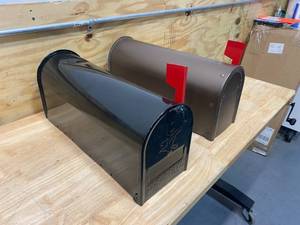 lot 60 image: Lot of 2- Mailboxes (1 black and 1 brown)