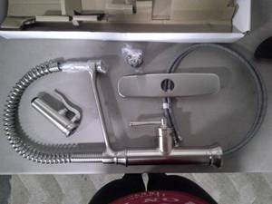 lot 302 image: GLACIER BAY Linscott Single-Handle Coil Springneck Pull-Down Sprayer Kitchen Faucet in Stainless Steel FP1B4202SS (BOX DAMAGED, BRAND NEW)