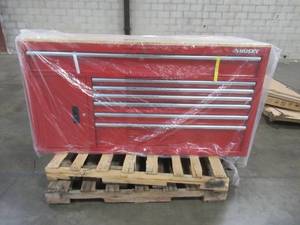 lot 321 image: Husky 61 in. W x 22.1 in D Standard Duty 7-Drawer 1-Door Mobile Workbench Tool Chest with Solid Wood Top in Gloss Red, HOTC6107B21M - 2 Broken Casters and slight dent in back.(REPLACEMENT WHEELS PROVIDED)